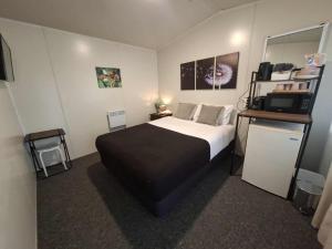 Postel nebo postele na pokoji v ubytování Mackenzie Motels