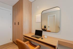 Et tv og/eller underholdning på Radisson Serviced Apartments Jardins Residencial