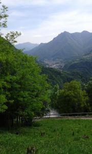 a view of a valley with mountains in the background at B&B Leo in Aviatico