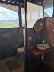 a bathroom with a sink and a toilet at Centro Holístico Kinam in Amecameca de Juárez +18 photos