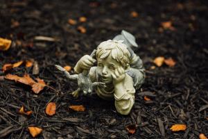 a small statue of a child holding a starfish at 6 min from Downtown Dahlonega, Wine Country, Game Room in Dahlonega