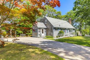 a house with a driveway in front of it at 1 Mi to Capron Park Zoo Quiet Family Getaway in Attleboro
