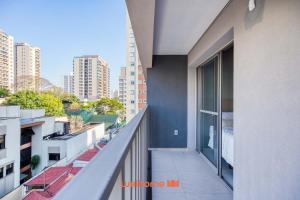 an apartment balcony with a view of a city at Studio na Vila Mariana proximo a Unifesp e Estacao in Sao Paulo +14 photos