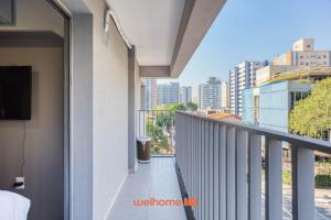 a balcony with a view of a city at Studio na Vila Mariana proximo a Unifesp e Estacao in Sao Paulo