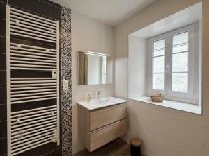 a bathroom with a sink and a mirror at Gliget in Lourdios-Ichère +48 photos