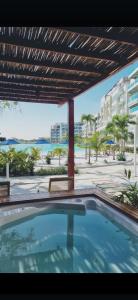 a swimming pool with a view of the beach at BAIA KRISTAL CARTAGENA Mi descanso ideal in Cartagena de Indias