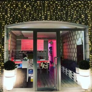 a entrance to a restaurant with a table in it at the central house piacenza in Piacenza