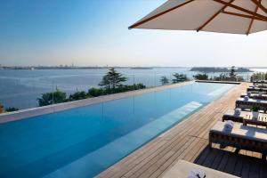 a swimming pool with a view of the water at JW Marriott Venice Resort & Spa in Venice