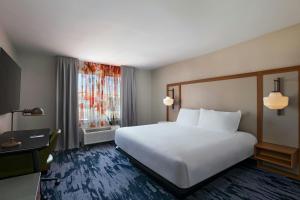 a hotel room with a bed and a window at Fairfield Inn & Suites Austin University Area in Austin +19 photos