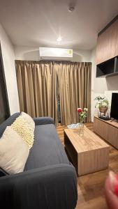 a living room with a couch and a coffee table at PoolAccess-rose Lahabana in Hua Hin +48 photos