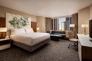 a hotel room with a bed and a living room at Fairmont Chicago Millennium Park in Chicago +67 photos