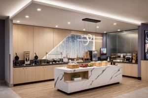 a large kitchen with a counter in the middle at Fairfield Inn & Suites by Marriott Chilliwack in Chilliwack