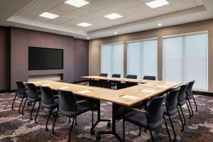 a conference room with a large wooden table and chairs at Fairfield Inn & Suites by Marriott Chilliwack in Chilliwack