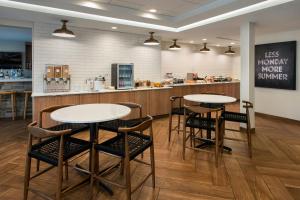 a restaurant with two tables and chairs and a counter at Fairfield Inn & Suites by Marriott Somerset in Somerset