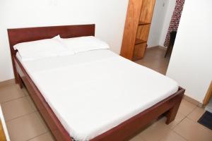 Ένα ή περισσότερα κρεβάτια σε δωμάτιο στο Serenity Guest House +2 φωτογραφίες