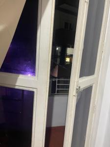 an open door with a window in a room at Condomínio Dom Francisco in Belém