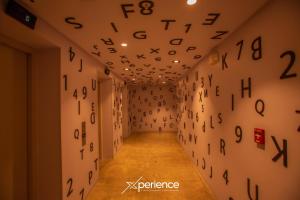 a hallway with numbers on the wall at Secrt Sabana 1BR · High Floor · Workspace + WiFi · Parking · Apt 2006 in Hatillo +47 photos
