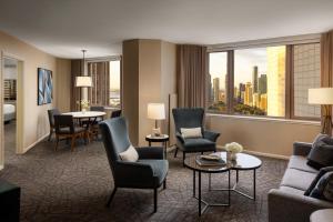 a hotel room with a view of a city at Fairmont Chicago Millennium Park in Chicago