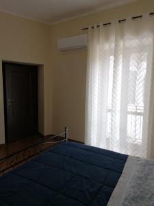 Ένα ή περισσότερα κρεβάτια σε δωμάτιο στο Mavianto