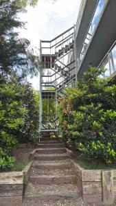a stairway leading up to a building with a metal ladder at Latitud 28 in Mar Azul