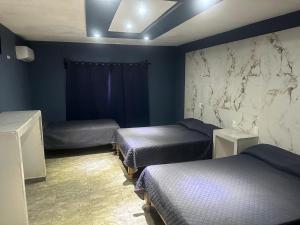 Postel nebo postele na pokoji v ubytování Hotel Calzada - La Barca Jalisco