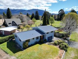 an aerial view of a house with a yard at View Over The Square in Te Anau