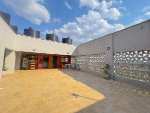 a building with a courtyard with chairs and smoke stacks at Kiambu cozy studio in Kiambu