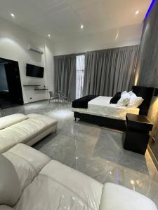 Ένα ή περισσότερα κρεβάτια σε δωμάτιο στο Penthouse 333