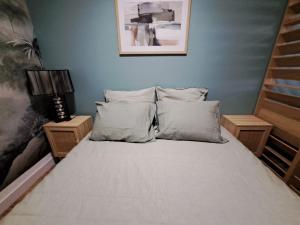 Ένα ή περισσότερα κρεβάτια σε δωμάτιο στο Wattrelos, T2 haut de gamme,proche transports