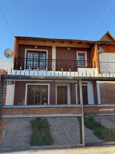 a building with a fence in front of it at desertico in Neuquén