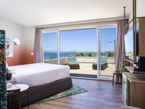 Postel nebo postele na pokoji v ubytování Mercure Rio Boutique Hotel Copacabana + 100 fotografií