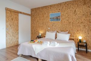 Postel nebo postele na pokoji v ubytování DesKanzo Guest House - Raúl Doria