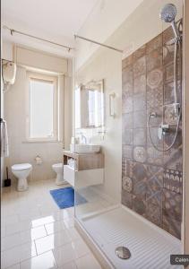 a bathroom with a shower and a sink and a toilet at Dolce Sicily a 1km dal centro in Palermo +39 photos