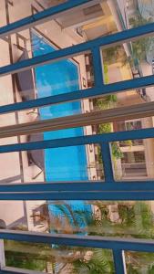 a reflection of a building in a window at Vickie's Home in Lagos
