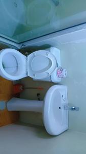 a bathroom with a toilet and a bidet at Vickie's Home in Lagos