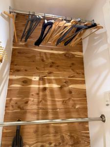 a walk in closet with wooden flooring and woodenadders at Studio Apartment with Garden Jersey City in Jersey City