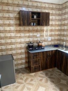 Kuchyň nebo kuchyňský kout v ubytování Comfort Luxury Serviced Apartments Owerri