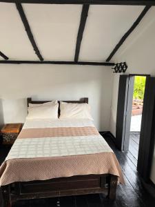 a bedroom with a bed in a room at Way Maker Santander in Suaita