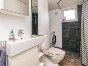 a bathroom with a sink and a toilet at 4 person holiday home in Hjørring-By Traum in Lønstrup