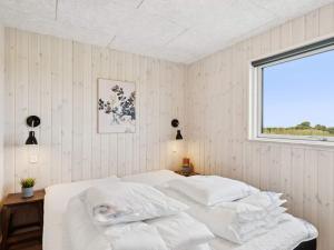 Ένα ή περισσότερα κρεβάτια σε δωμάτιο στο 5 star holiday home in Bogense +58 φωτογραφίες