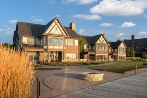 a large house with a landscaping in front of it at St. Clair Inn in St. Clair