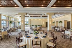 a banquet hall with round tables and chairs at St. Clair Inn in St. Clair