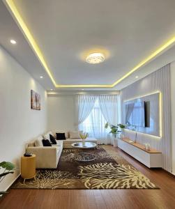 a living room with a couch and a zebra rug at Noah Luxury Airport Drive Gated Apartment in Addis Ababa