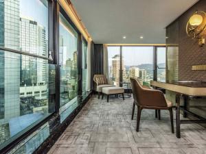 a hotel room with a view of a city at Mercure Chongqing Downtown in Chongqing