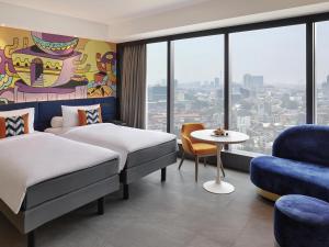 Postel nebo postele na pokoji v ubytování ibis Styles Jakarta Tanah Abang + 50 fotografií