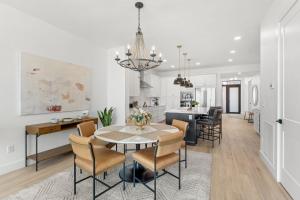 a kitchen and dining room with a table and chairs at Harbor Island Beach Club 205 in Melbourne Beach