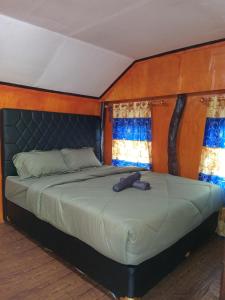 Postel nebo postele na pokoji v ubytování Glampar Homestay 2