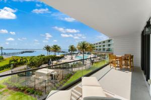 a balcony with a view of the ocean at Harbor Island Beach Club 205 in Melbourne Beach