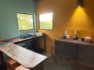 a kitchen with a sink and a counter with a counter at El Cerrito in Puerto Jiménez +41 photos