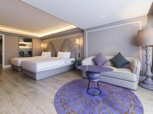 Giường trong phòng chung tại Mercure Xi'an Downtown +72 ảnh